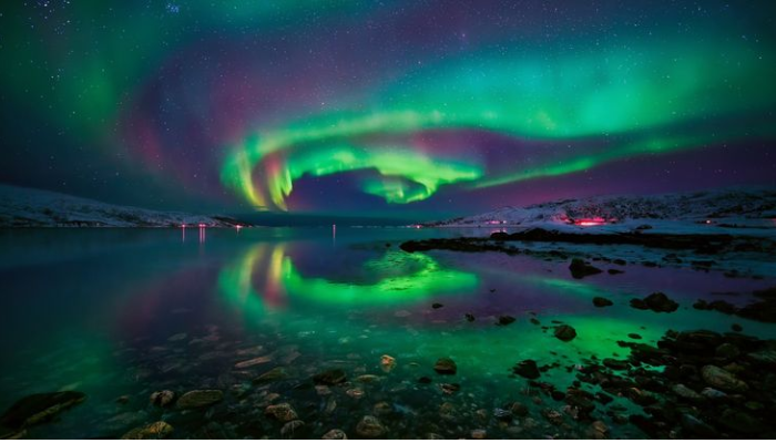Why are the Northern Lights sometimes colored differently?